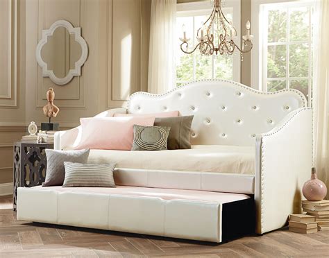 Upholstered daybed with trundle - If you want the best daybed with a trundle, meet the Carthusia Upholstered Daybed. It doubles as a classy couch, with scrolled arms and button-tufted upholstery, and offers two sleeping options for guests. With two neutral color options (gray and beige), it’s sure to blend in with most living rooms or guest bedrooms.